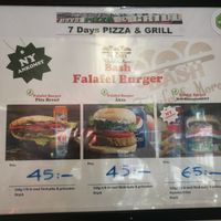 The two first burgers in the picture are vegan, the third one contains cheese but you can request without it. at 7 Days Pizza & Grill in Malmo