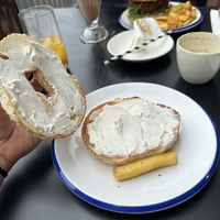 Everything bagel with vegan cream cheese! And one chip off hubs plate lol   at Sable in Richmond