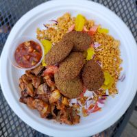 Falafel bowl with bulger, onions, tomatoes, banana peppers, shakshooka, hot sauce at Troy Grille in Kent