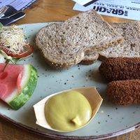 Groentekroketten op brood. Lege gat is van de roomboter die er bij zat 😱 at Aan de Gracht in Elburg