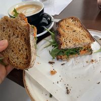 Sandwich vegano with hummus, tomato and rocket   at Los Picos Café in Valencia