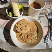 Plant based sausage and gravy with fruit cup and chai latte at Hibiscus Cafe in Grayton Beach