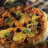 Vegan cheese, olives, dried tomatoes, potatoes  at Tom 'n' Jerry in Berlin