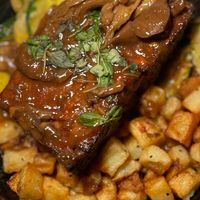 Vegan Meatloaf with mushroom gravy, roasted potatoes, and vegetables at 600 Kitchen and Bar in Kalamazoo