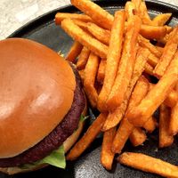 Beetroot quinoa burger: smashed avocado, lettuce, homemade vegan mayo, served with sweet potato fries  at Jam Limassol in Limassol