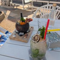 Starting with cocktails; lounge sofas in the background at Boat House Bar in Mallorca