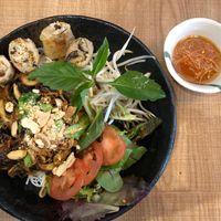 Vegan Verm. Lemongrass chili, spring roll, oyster mushroom, king oyster mushroom, wood ear mushroom, carrot, fresh herbs, salad, peanut, on vermicelli. at Do Chay - Yaletown in Vancouver