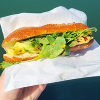 Avocado sandwich with riccola, chili flakes, and a white sauce at Brezelkönig in Olten