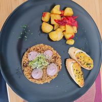 risotto w wild mushrooms, boiled potatoes w bell peppers, baguette w vegan egg - kala namak toasted goodness.  at Planet One in Arbon