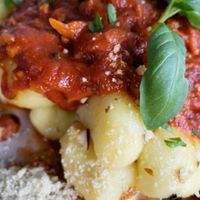 vegan gnocchi bolognese with homemade vegan parmesan 💚🌱👌🏻  at Planet One in Arbon