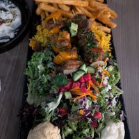 Plato de 2 brochetas: una de "pollo" y una de "cordero" at Sham - Mont Royal in Montreal