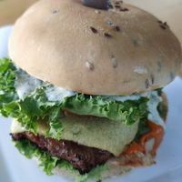 August burger with soy patty. I liked the knife on top. at Veganbar in Bremen