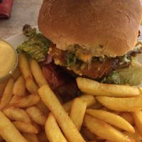 BigSchmeck burger with vegan bacon, fried vegan cheese and seitan patty at Veganbar in Bremen