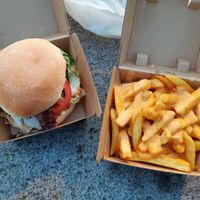 Classic burger and fries with cashew "cheese" sauce at Veganbar in Bremen