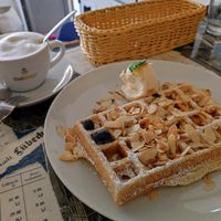 Cappucino with oat milk and vegan marcipan waffle eith Amaretto and vegan vanilla ice cream at Kleines Waffelhaus in Luebeck