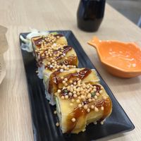 Smokey and incredible! The tempura oyster mushrooms on the inside were a really nice addition as well  at Wellness Sushi in Denver