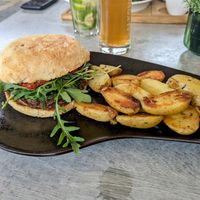 Vegan homemade bean burger with roast potatoes. Potatoes were good combined with the cream from the sweet potato rösti. at Altes Backhaus in Bleialf