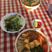 seating outside to watch the buzzing surroundings at Bo De Tam in Prague