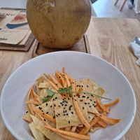 Korean salad with tofu skin and coconut in the back at KURUMI - Healthy Vegan Food & Desserts in Da Nang