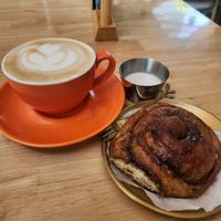 Cinnamon Roll and Oat Milk Cappuccino at KURUMI - Healthy Vegan Food & Desserts in Da Nang