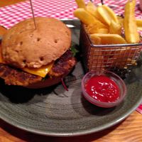 Vegan burger with homemade bean patty and fries at Heuboda in Brand Bei Bludenz