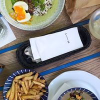 vegetarian hummus bowl (top) & fries and vegan lentil soup (bottom) at Mazel Tov in Budapest