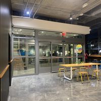 Seating Available Steps Away from Food Area  at PLNT Burger - Florida Ave in Washington