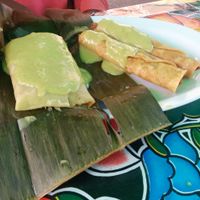 2 taquitos - textured soy protein rolled in corn tortilla & fried, with banana leaf tamale  at Flacos in Berkeley