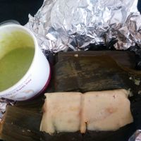 Banana leaf tamales - soy protein in savory mole, capers, potatoes, green olives inside organic corn masa steamed in banana leaf at Flacos in Berkeley