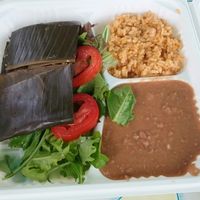 plate with refritto beans, rice, salad and our choice of at Flacos in Berkeley