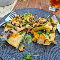 Flatbread with hummus and veggies. Excuse the half eaten part! 😅 at de Prins in Buren