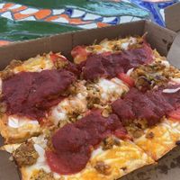 vegan cheese with tomatoes, onions, and bbq tempeh at Satch Squared in Gainesville