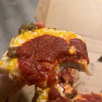 Slice of vegan deep dish pizza  at Satch Squared in Gainesville