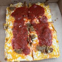 Vegan pizza under different lighting  at Satch Squared in Gainesville