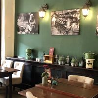 old photos on the walls with images of world cuisine at Stoof in Sneek