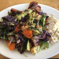 Tempeh with mixed veggies and spicy garlic sauce served with brown rice  at Bela in Northampton