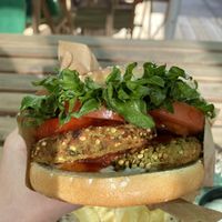 The vegan burger “The Mikala”. It comes with vegan mayo and chips. at Café Braetspil in Haslev