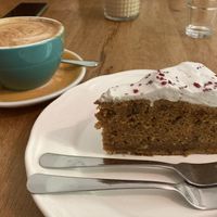 A piece of carrot cake and soy cappuccino   at Arome in Bucharest