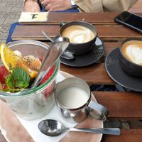 Yoghurt with granola and fruits, and capuccino's with oat milk at Plan Cafe in Berlin