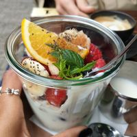 This coconut yoghurt was with banana, strawberry, raspberry, blueberry, orange, grapes, mint, seeds and some orange type of grape and granola at Plan Cafe in Berlin