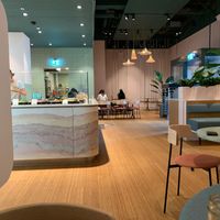 bowl preparation area with a part of the seating area including two fun tables with swings for chairs  at SESH in Wallisellen