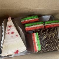 Strawberry cheesecake, peanut butter brownie and tri color cookies at Papa Ganache in Matawan