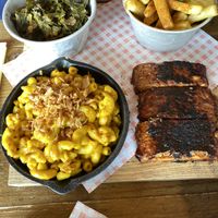 Smoked tempeh ribs with Mac and cheese, fries and collard greens   at Stoked Vegan BBQ in Westcliff-on-sea
