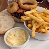 Onion ring burger with chips and coleslaw at The Dorset Burger Company in Weymouth