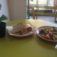 Sharwama wrap, Green Goddess & Greek salad.   at How On Earth in Exeter