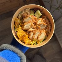 Loaded salad with seitan fried “chicken”, lime slaw, Bombay potatoes, roasted garlic houmous, Greek salad and chimichurri corn    at How On Earth in Exeter