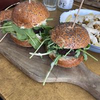 2.5 of the mini burgers. In the back are fries with truffle sauce at Submarine Burger in Rijeka