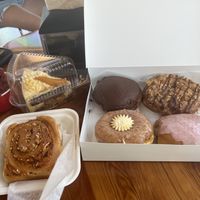 Peach pie, berry ice cream, pizza roll. Donut includes a Boston cream, and cherry almond, Samoa, and peaches and cream.   at Joyfully Baked in Gainesville
