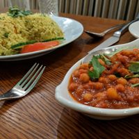 Heart shaped vegan Biriani with chickpea side dish  at Panshee in Swansea