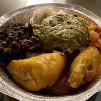 Bowl with black beans, sofritos, plantains, coconut rice and guacamole .  at The Floribbean in St Petersburg